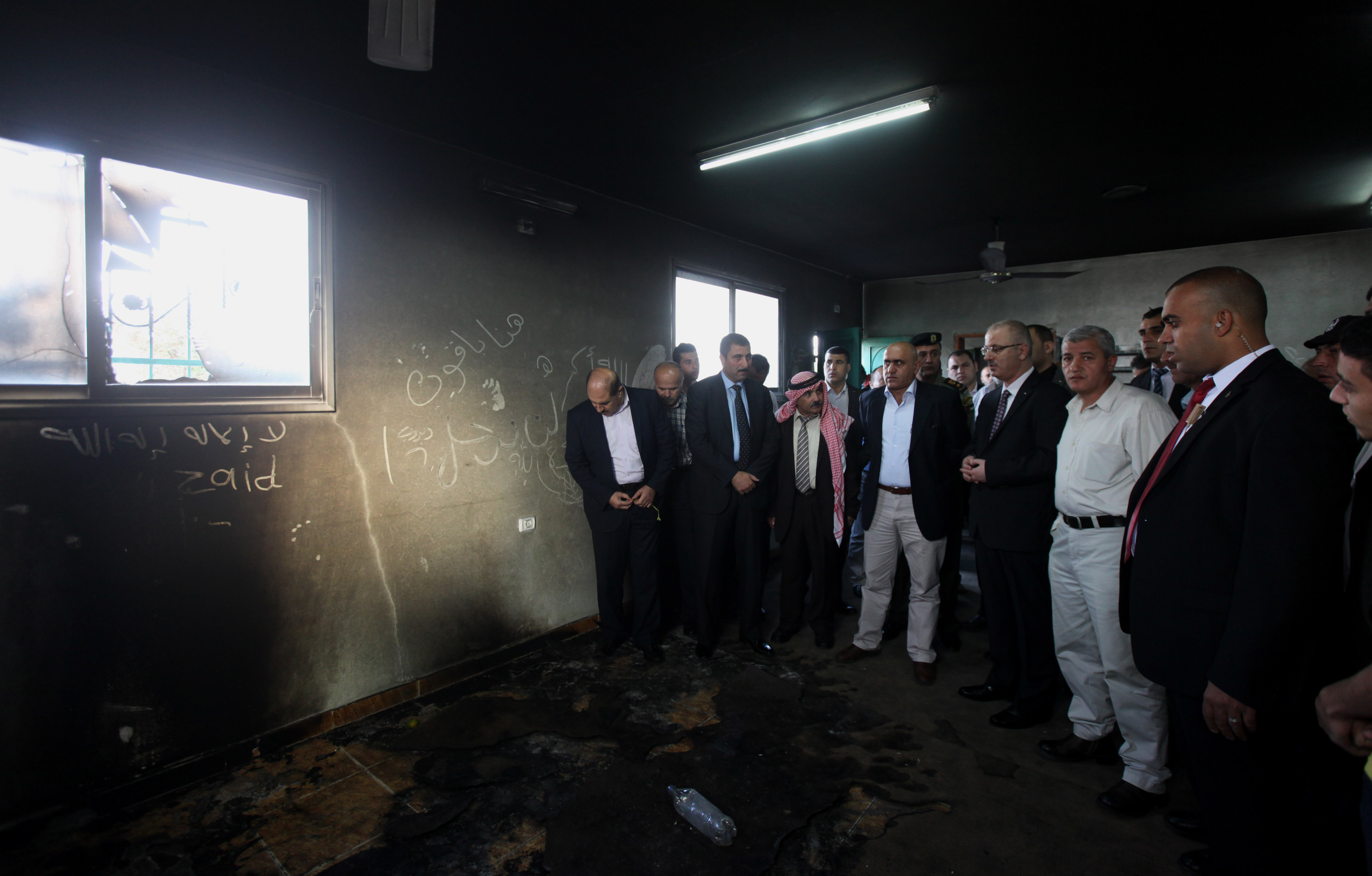 Prime Minister of the Palestinian coalition government Rami Hamdallah during his visit to the partly charred Abu Baker Al-Seddeeq Mosque that was set afire by Jewish settlers in town of Aqraba