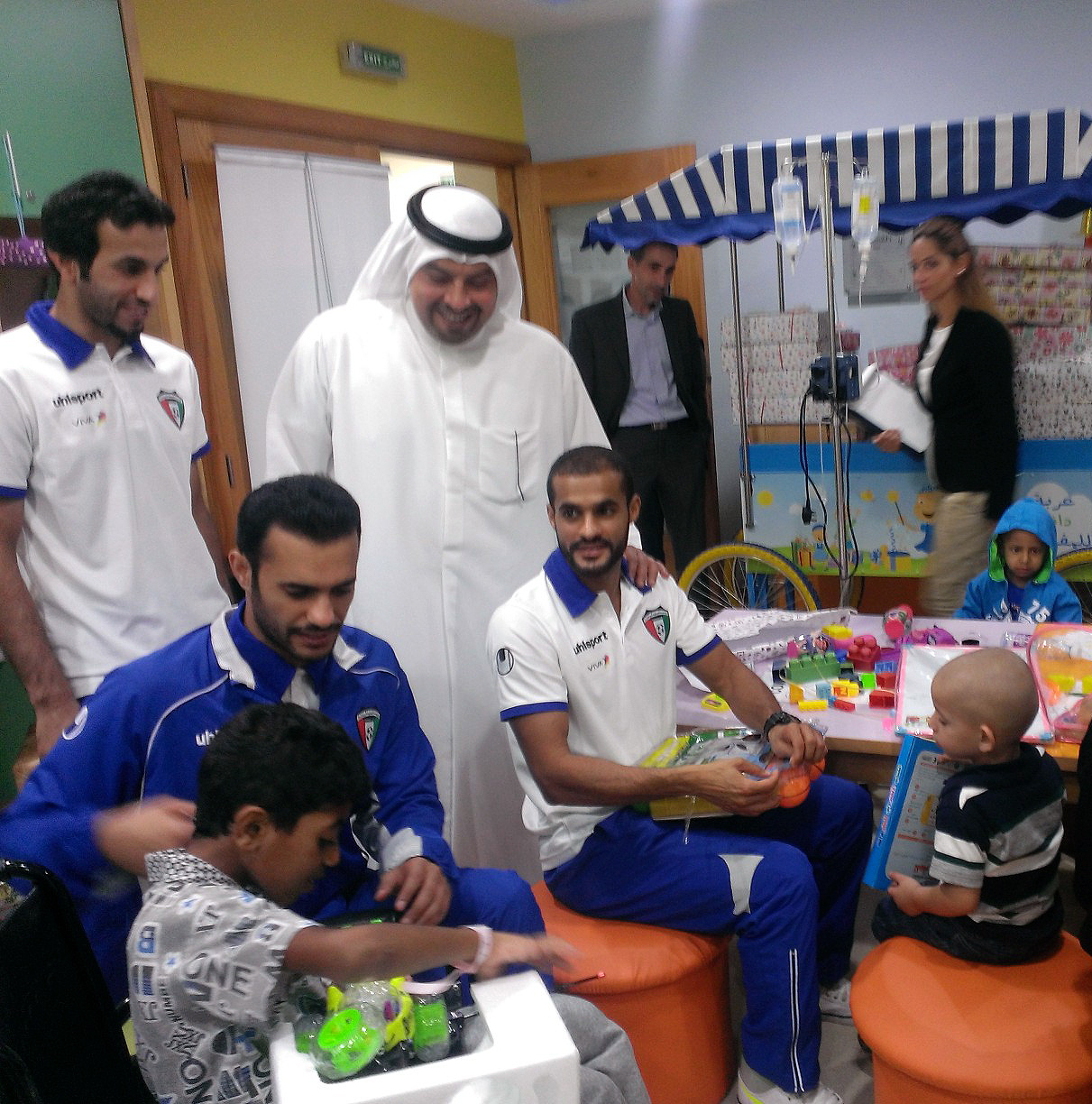 KFA President Sheikh Talal Fahad Al-Sabah with the national football squad during the visit to King Hussein Cancer Foundation 