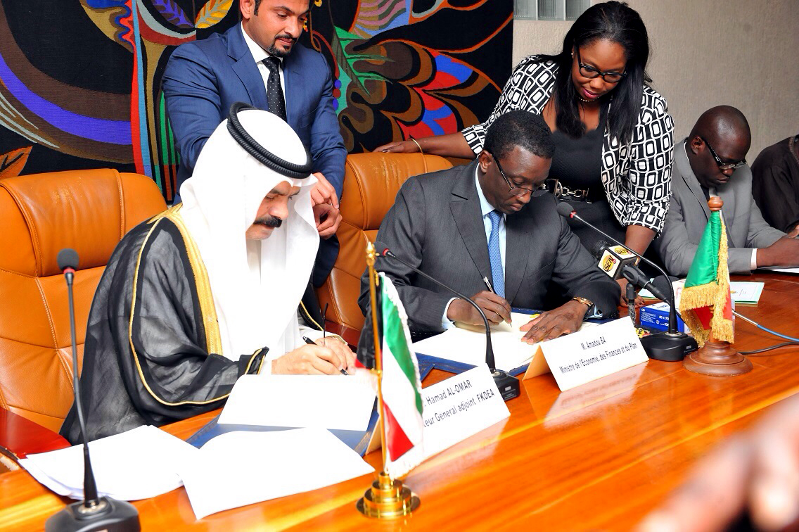KFAED's Deputy Director-General Hamad Al-Omar and Senegalese Minister of Economy and Finance Amadou Ba sign the agreement