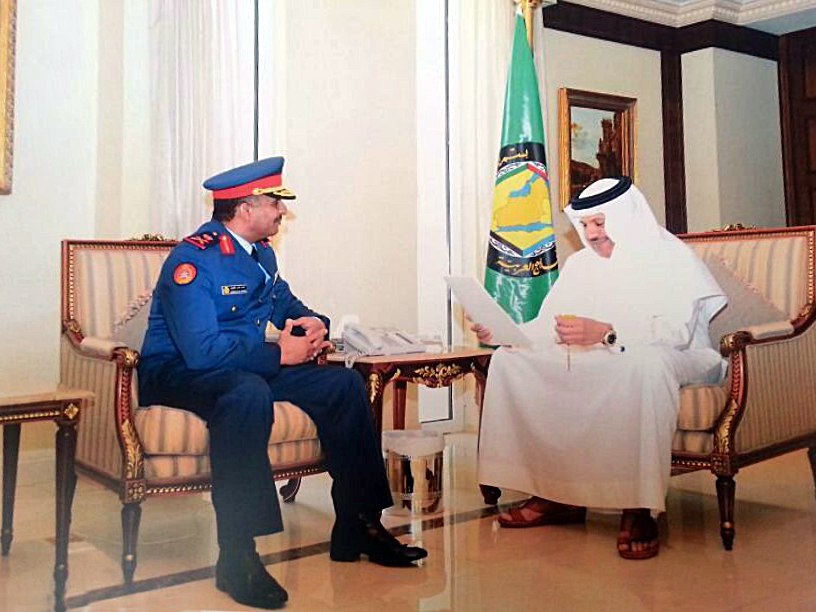 The Kuwaiti military attaché to Saudi Arabia Major General Musa'ad Nassar Al-Mutairi handing the invitation to Secretary General of the Gulf Cooperation Council (GCC) Dr. Abdullatif Al-Zayyani