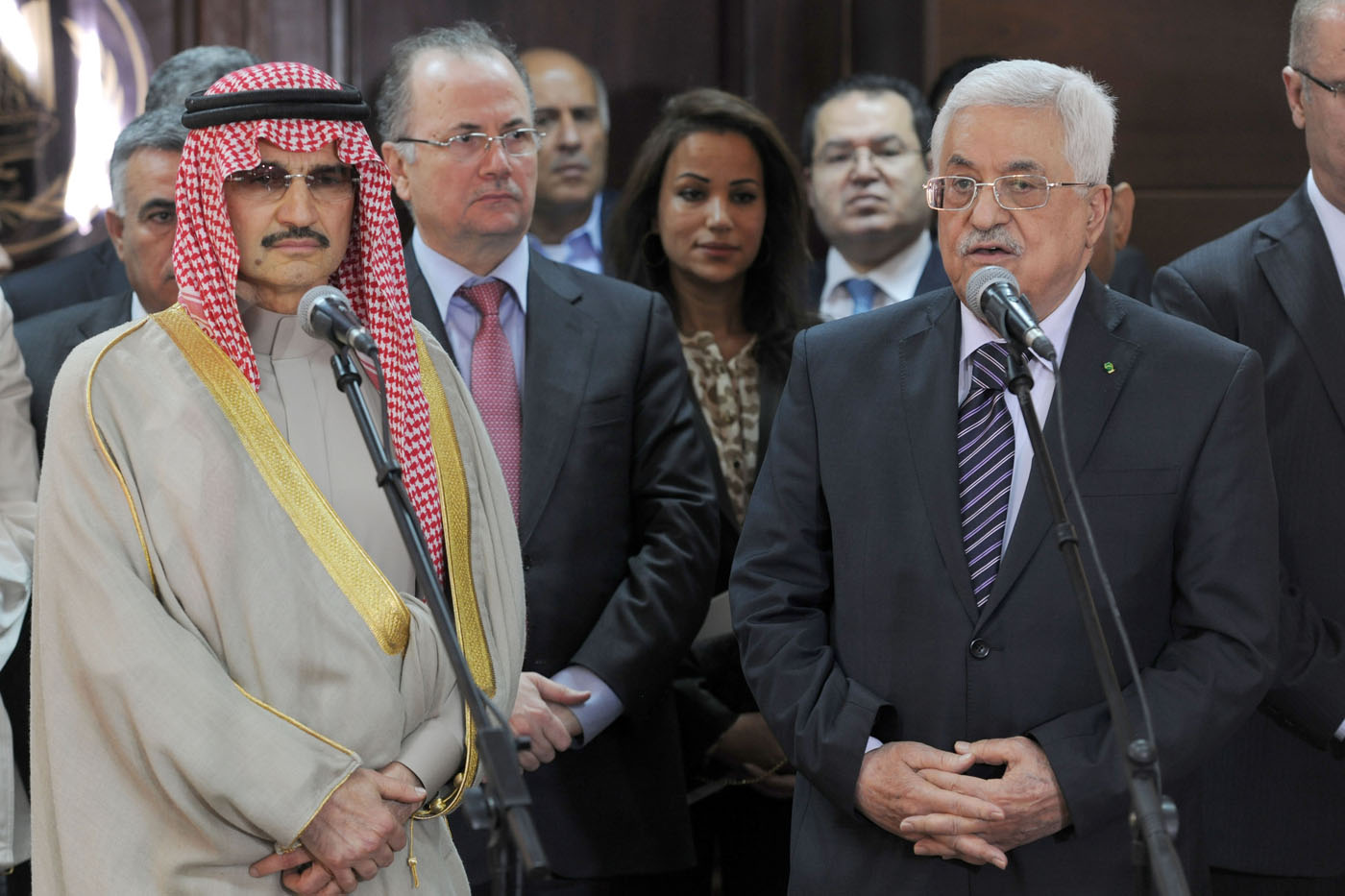 Palestinian President Mahmoud Abbas and Saudi Arabia's Prince Al-Waleed bin Talal