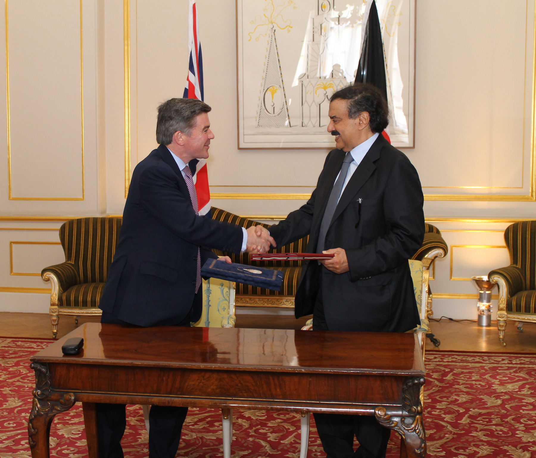 Kuwait Foreign Ministry Undersecretary Khaled Al-Jarallah and British Secretary of State for the Middle East and North Africa Hugh Robertson