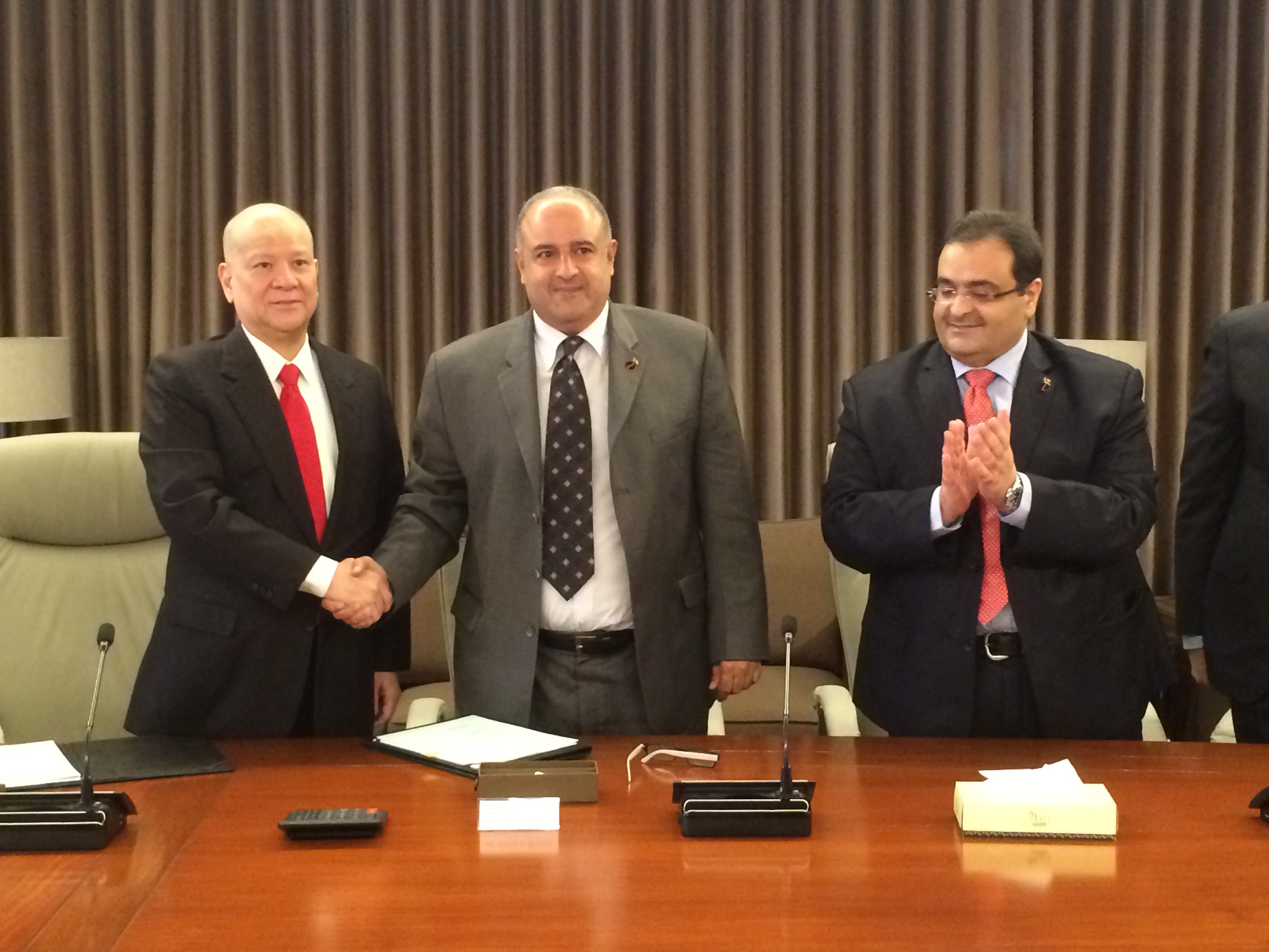 KPC's International Marketing Managing Director Nasser Al-Mudhaf and Petron Singapore Ltd Chairman and CEO Ramon S. Ang after signature