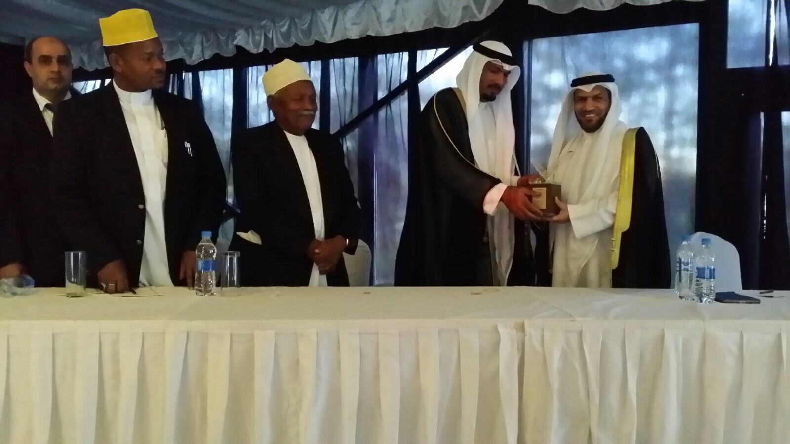 Kuwaiti Ambassador in Tanzania Jassem Al-Najem along with local officials honor a group of Quran memorization contestants