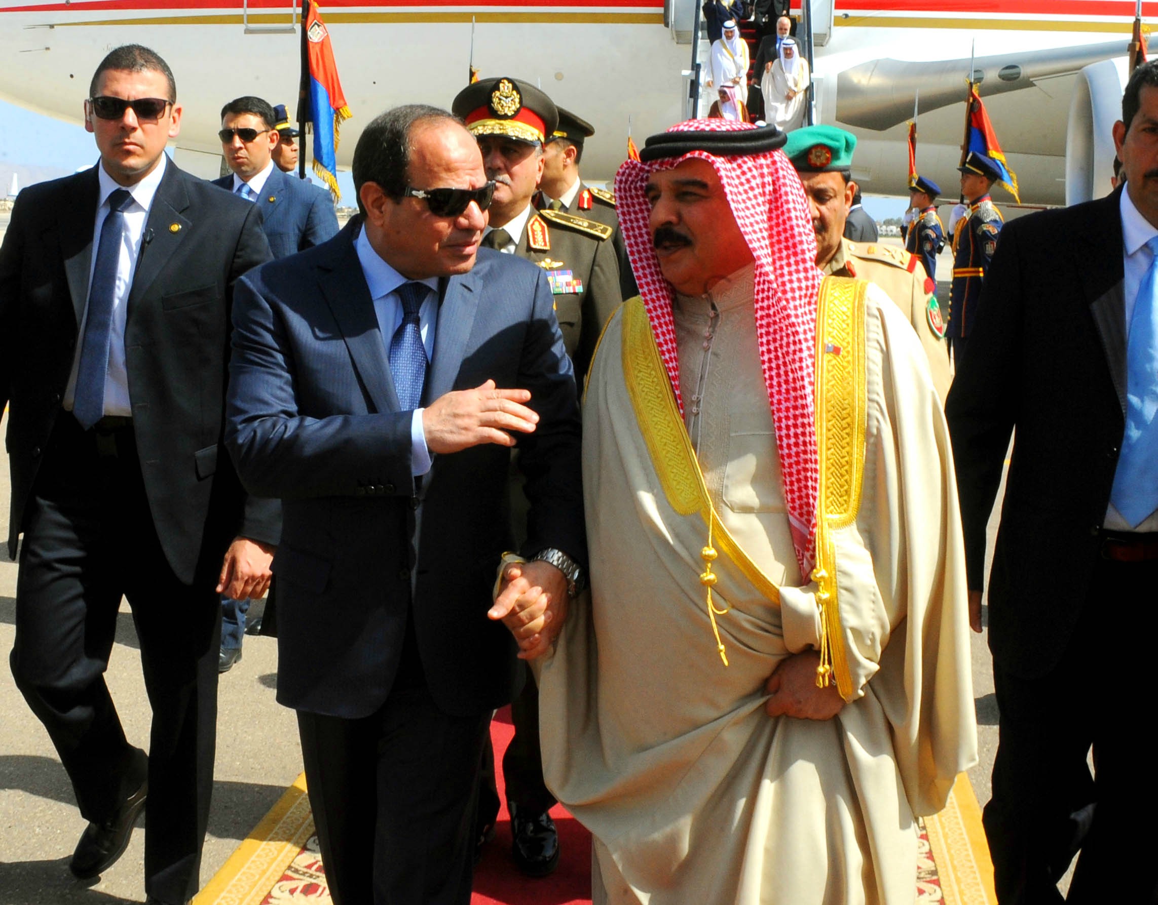 Egyptian President Abdelfatah Al-Sisi receives Bahrain's King Hamad bin Essa Al-Khalifa upon arriving at Sharm El Sheikh, to attend the 26th Arab Summit