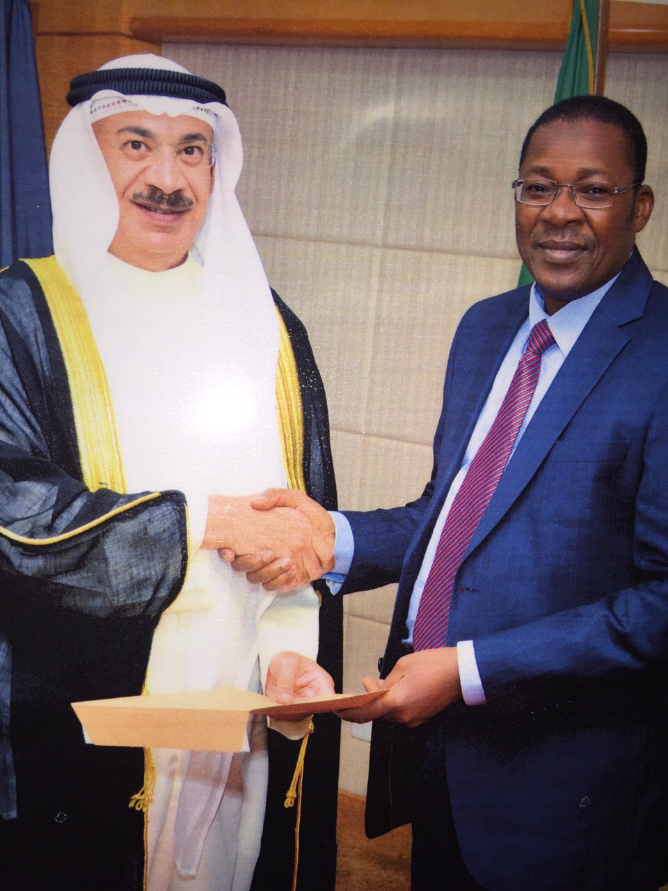 Kuwaiti Ambassador to Benin Fayez Mishari Al-Jassim hands the letter to to Benin's Foreign Affairs Minister Nasiro Bakoo