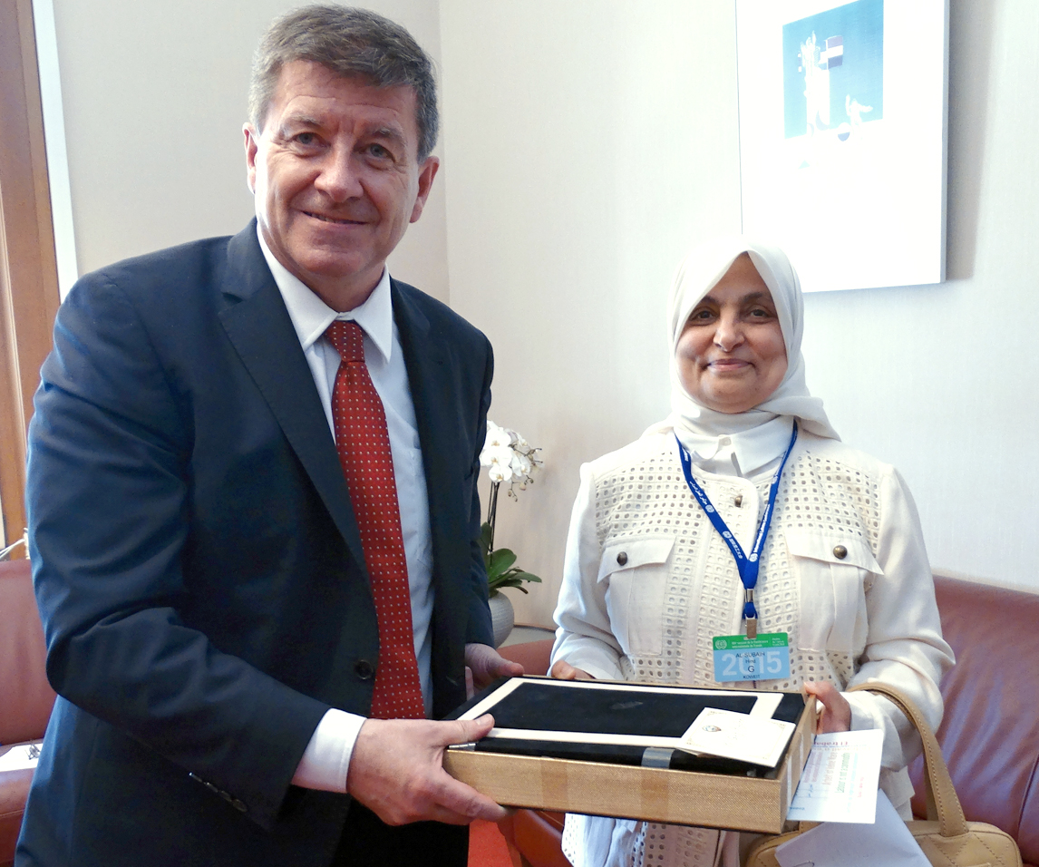 Minister of Social Affairs and Labor and Minister of State for Planning and Development Hind Sabeeh Al-Sabeeh with International Labor Organization (ILO) Director-General Guy Ryder