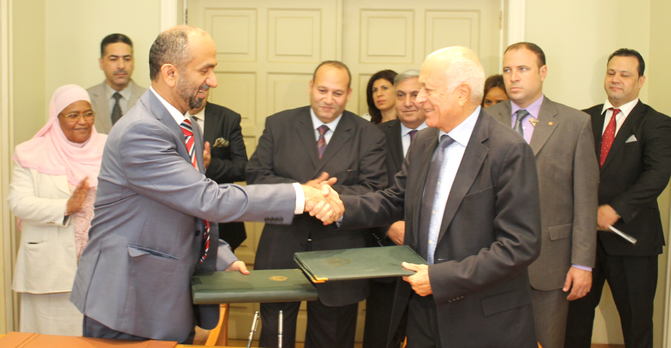 Arab League Secretary General Nabil Al-Arabi and Arab Parliament Speaker Ahmed Al-Jarwan during signed a memorandum of cooperation to establish an official partnership between the two bodies