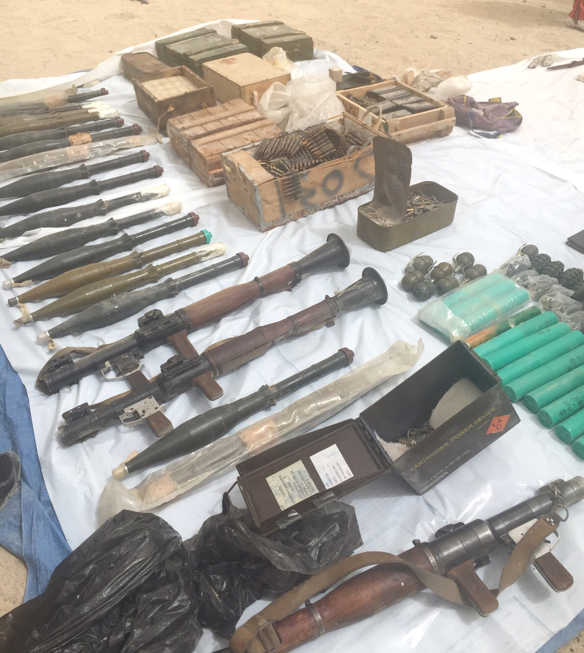A quantity of weapons and explosives inside a dumpster in Gharnata area