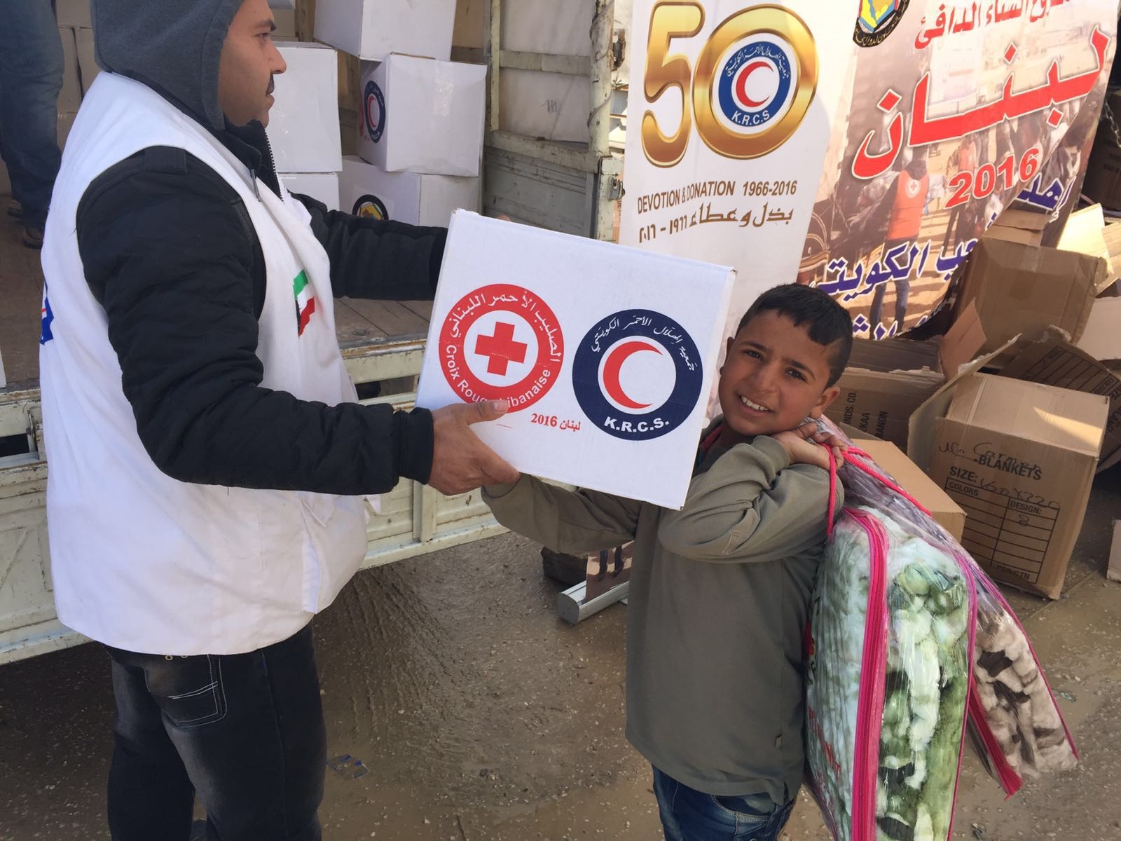 Members of Kuwait Red Crescent Society (KRCS) distributed humaintarian aids on displaced Syrian families in Lebanon