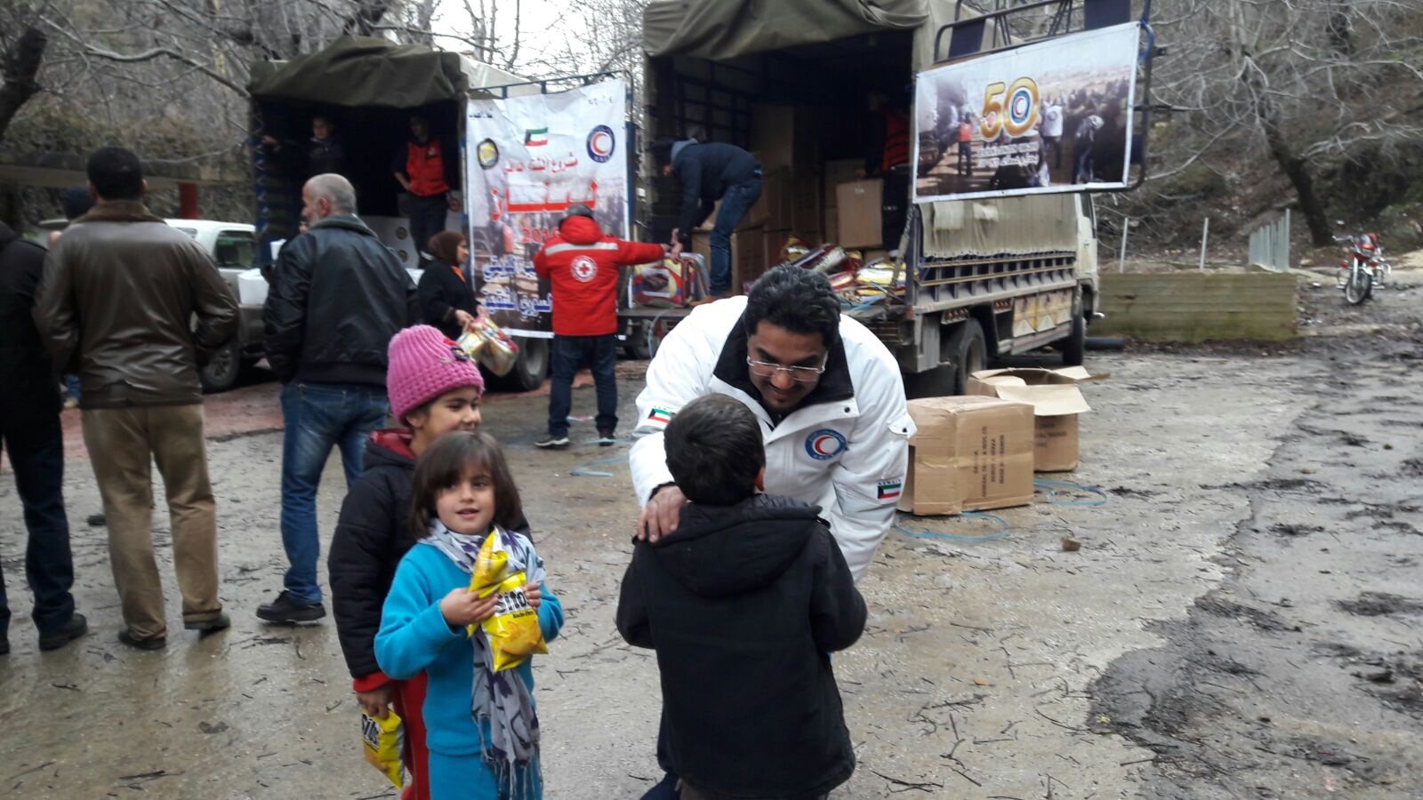 Teams of Kuwait Red Crescent Society delivered food and other necessities to Syrian refugee