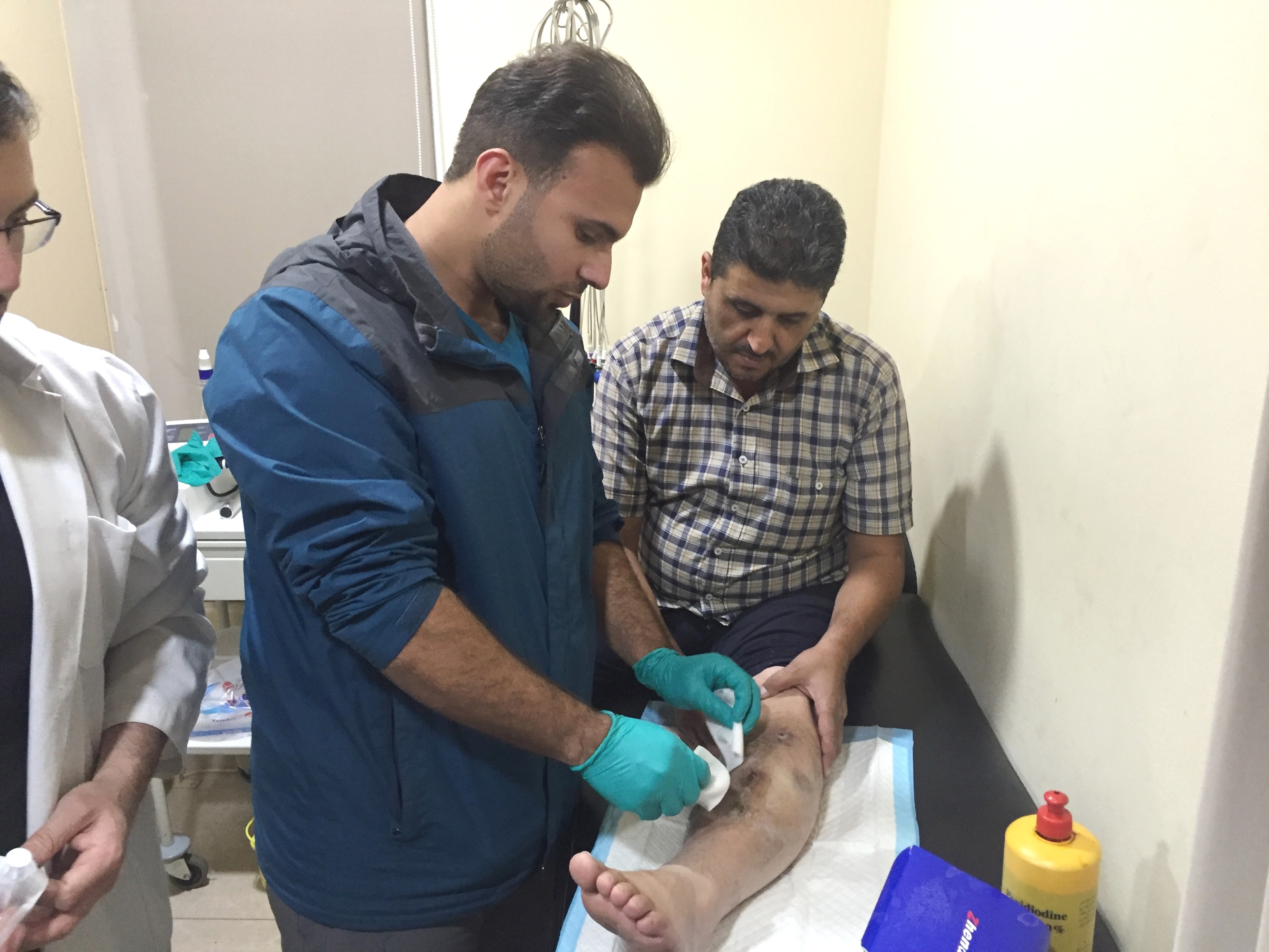 Member of the Kuwaiti Medical Association Dr. Ahmad Al-Mohammad conducts surgeries for displaced Syrians in Lebanon