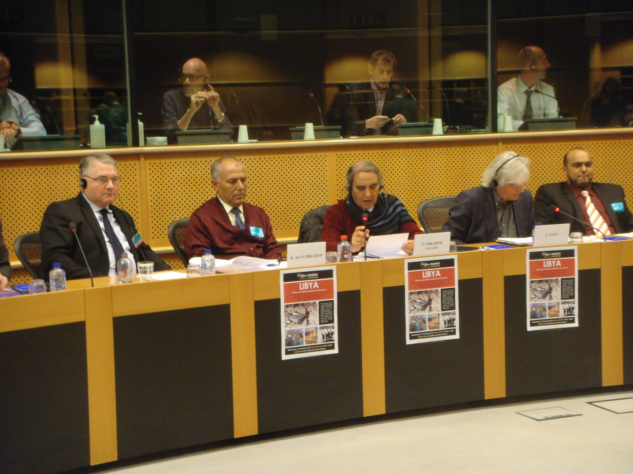 Three Libyan deputies from the parliament in Tobruk speaks at a conference in Brussels on the current situation in Libya