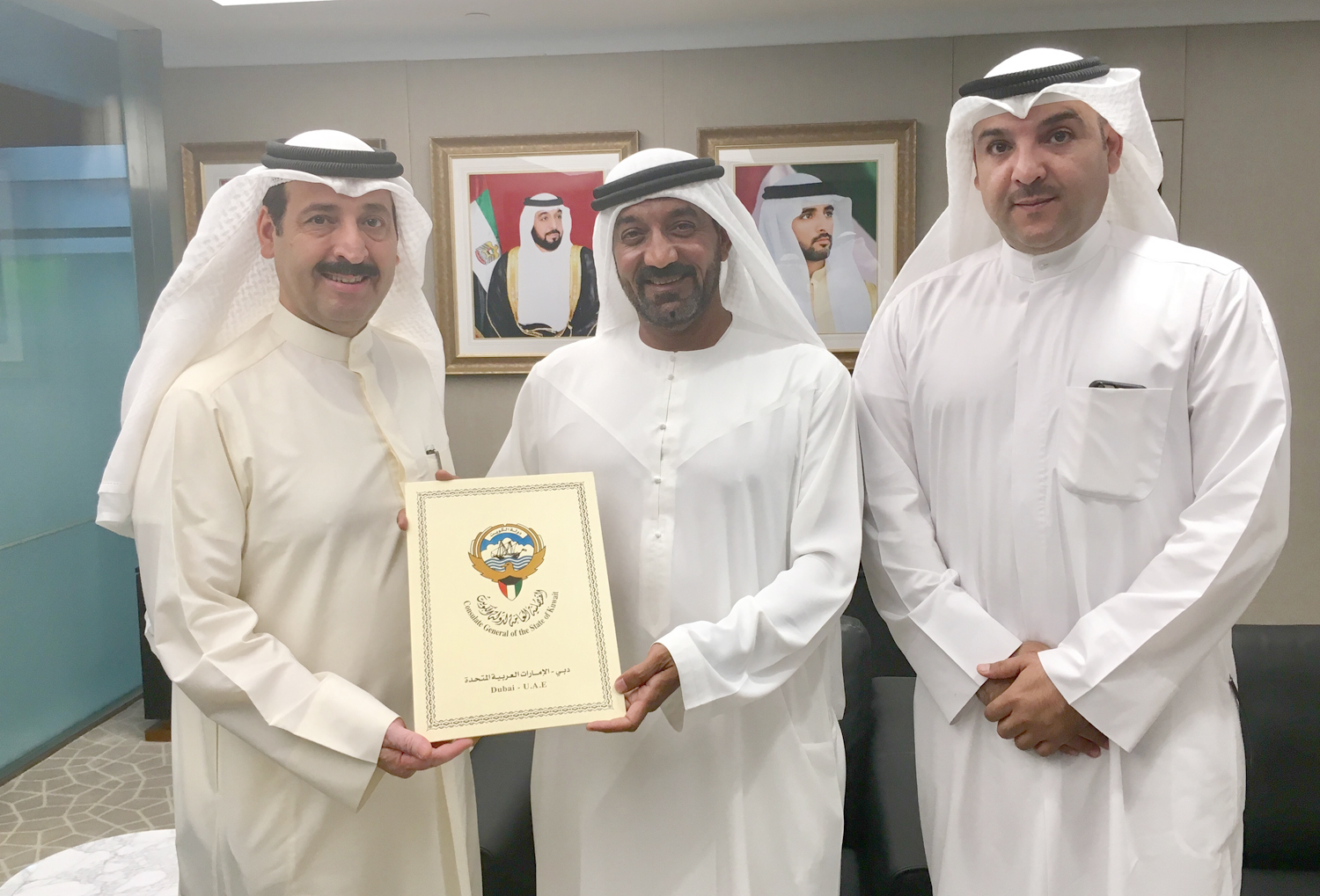 Kuwait Consul General in Dubai and UAE's Northern Emirates Theyab Al-Rashidi delivers its participation paper in the international fair" Expo 2020" Chairman of the Expo 2020 Dubai's Higher Committee Sheikh Ahmad Bin Saeed Al Maktoum