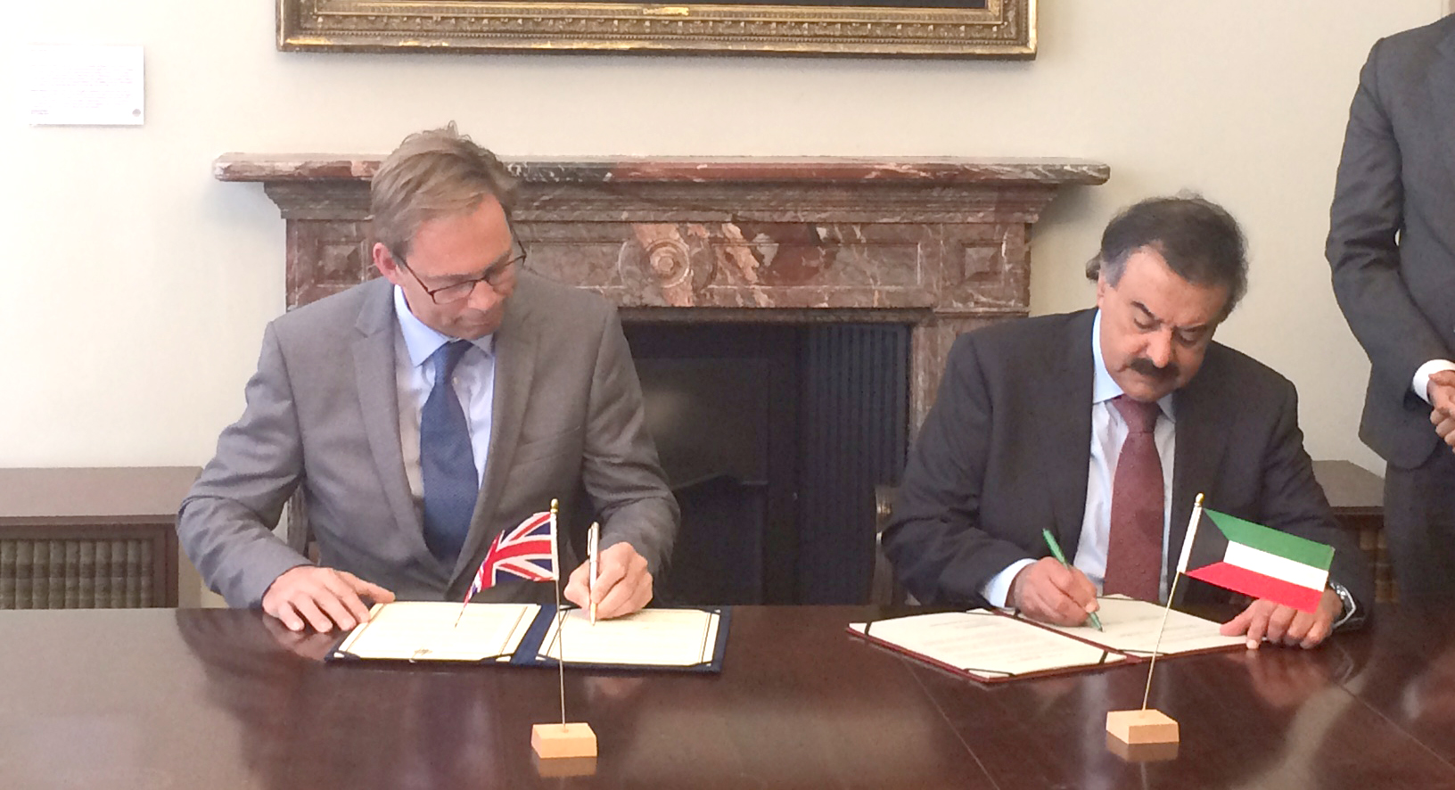 Deputy Foreign Minister Khaled Suleiman Al-Jarallah and British Minister for the Middle East and North Africa Tobias Ellwood sign the action plan