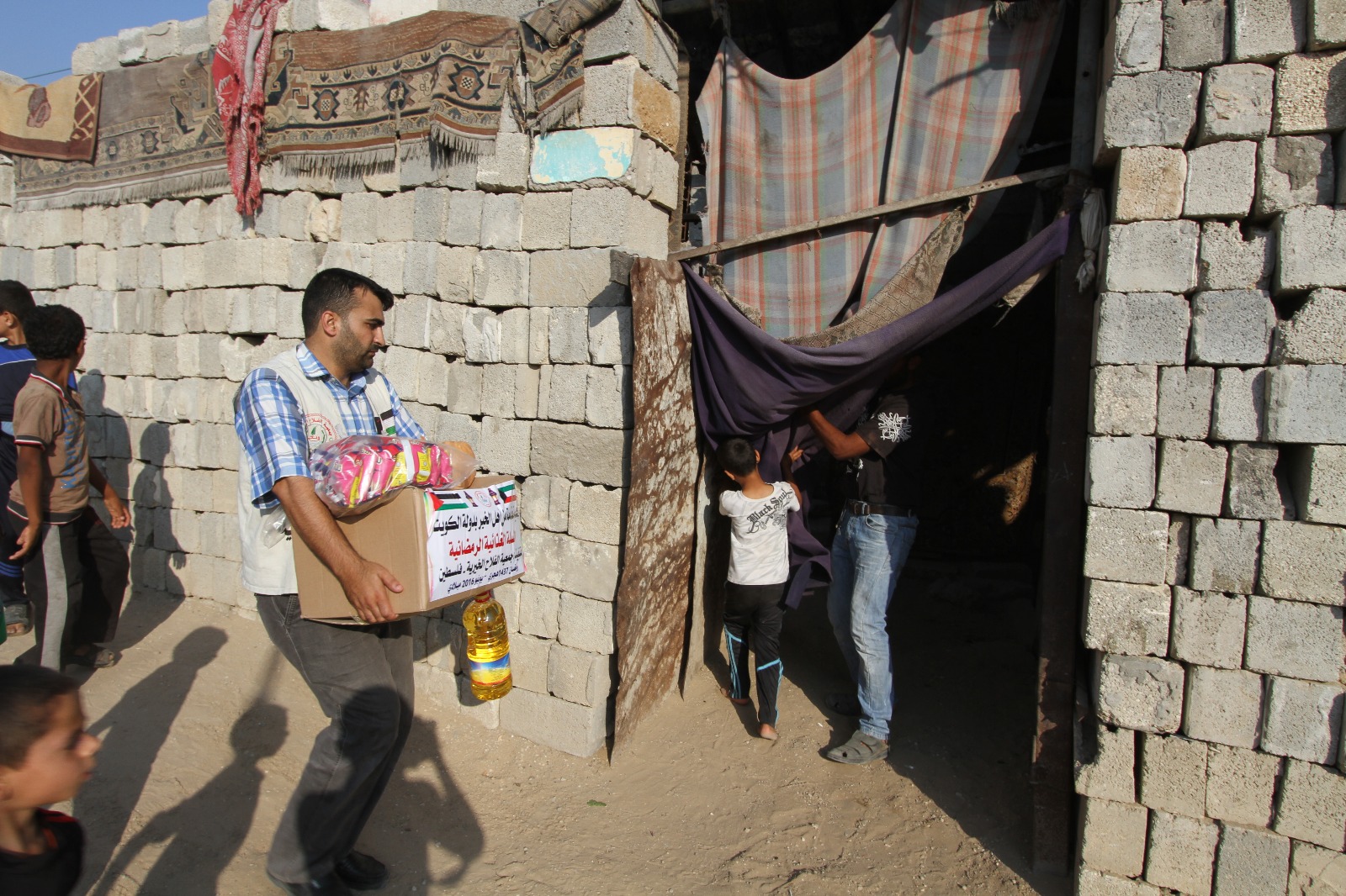 Palestinian Al-Falah charity's distribution of Kuwaiti aid to the poor and needy families in the Gaza Strip