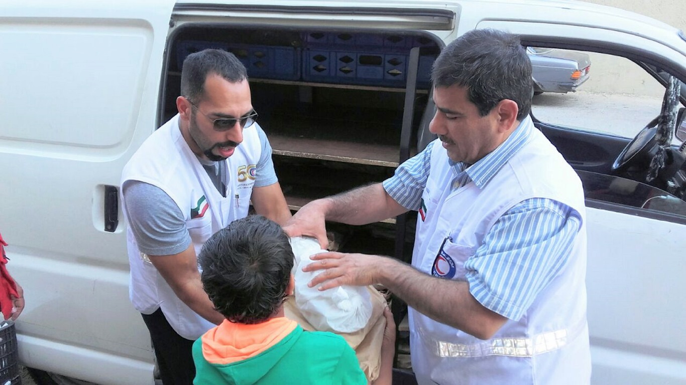 The Kuwait Red Crescent Society (KRCS) handing out Iftar (fast-breaking) meals to Syrian refugees in Lebanon, as part of a continued humanitarian campaign during the holy month of Ramadan