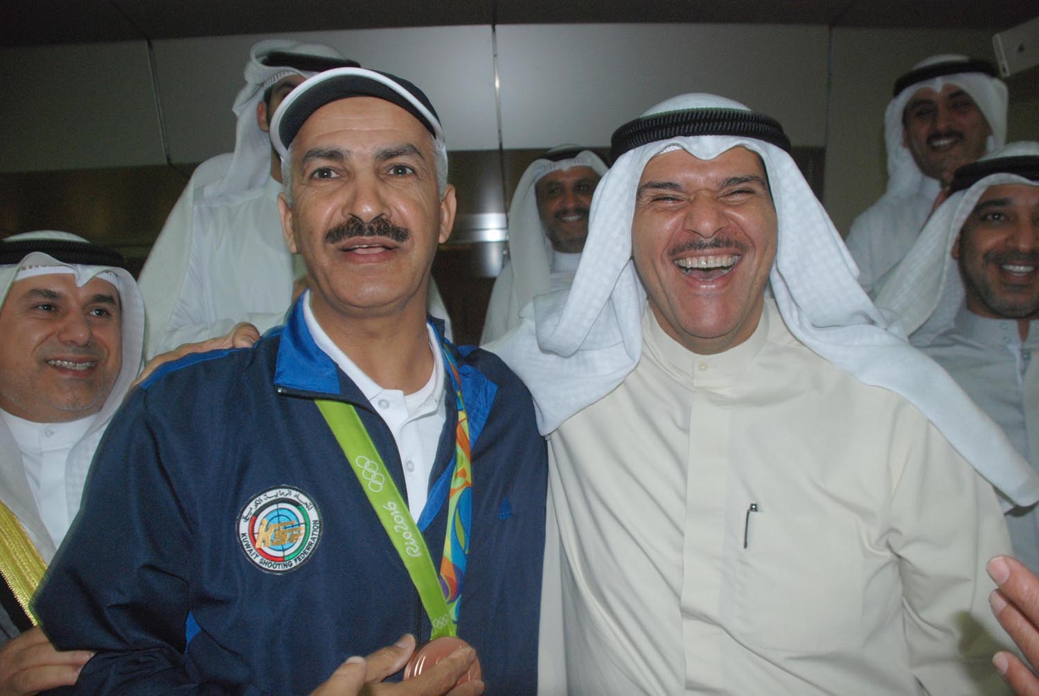 Minister of Information and Minister of State for Youth Affairs Sheikh Salman Al-Sabah receives the Kuwaiti skeet shooter Abdullah Al-Rashidi