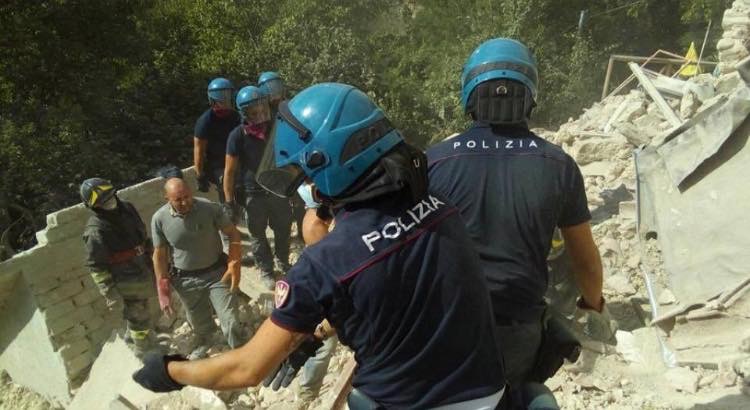 Italian police and fire department personnel rescue casualties