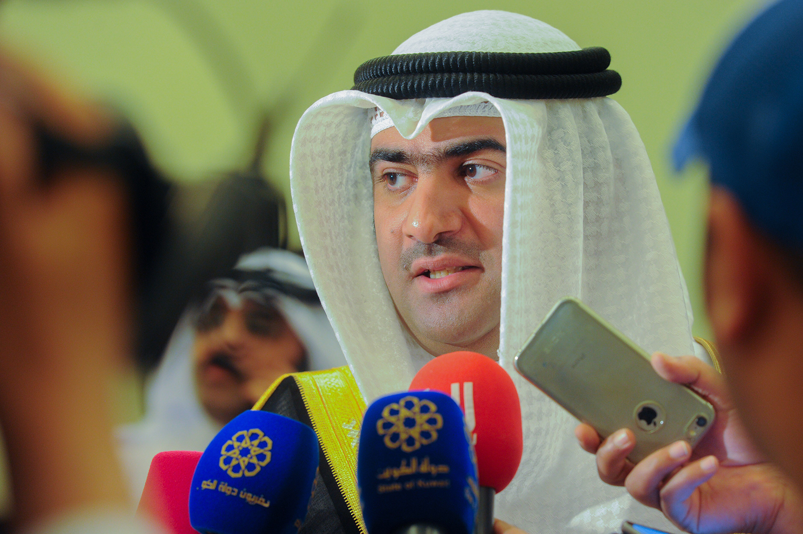 Minister of Commerce and Industry and Acting Minister of State for Youth Affairs Khaled Al-Roudhan speaks to the press