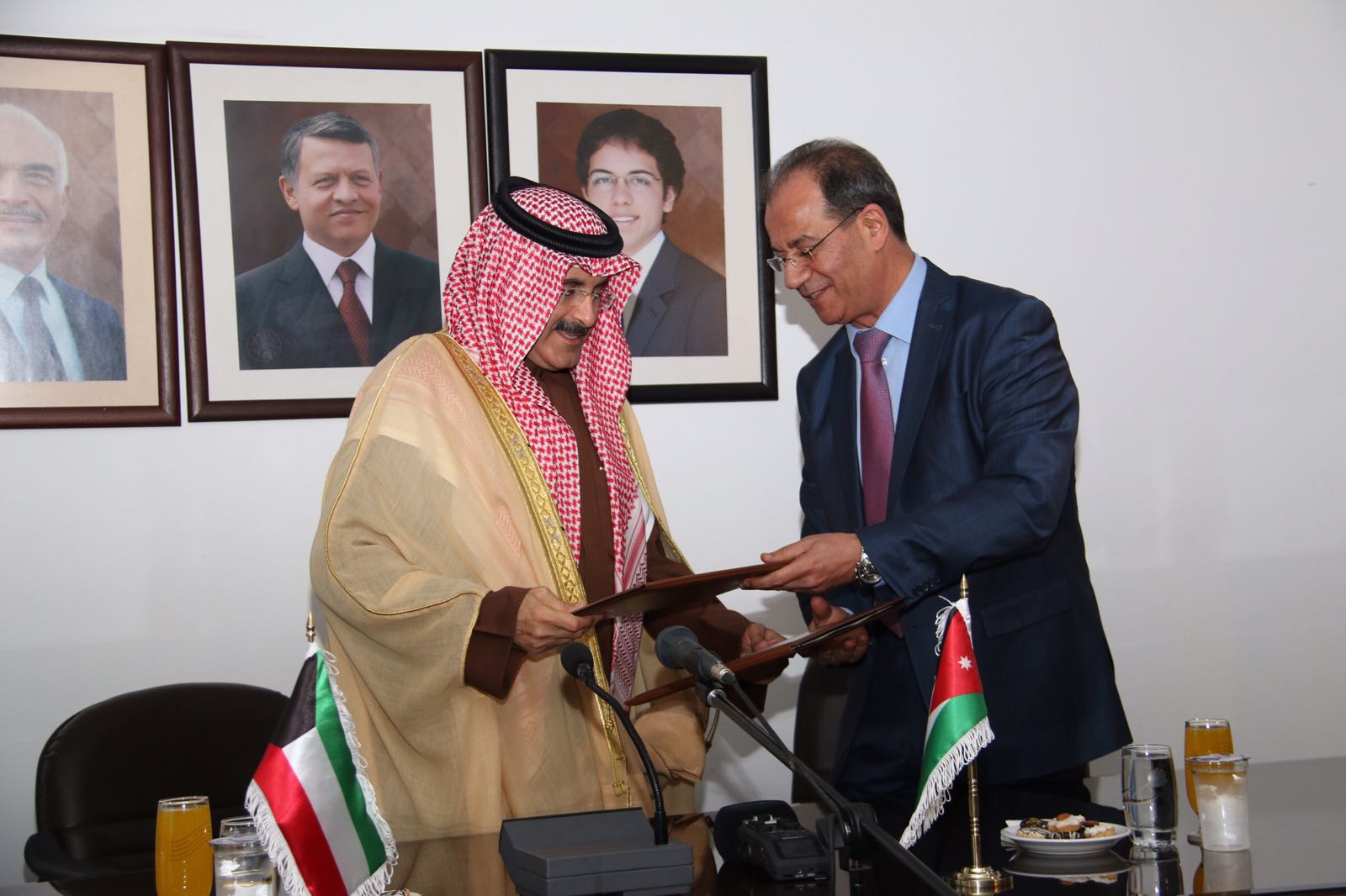 President of the Federation of Arab News Agencies, Chairman and Director General of KUNA Sheikh Mubarak Al-Duaij Al-Sabah and Petra's Director General Faisal Shboul during the signing ceremony
