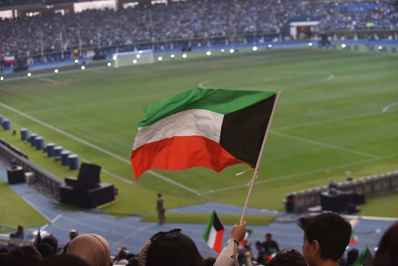 Kuwait flag hovers over the crowds in Jaber International Stadium