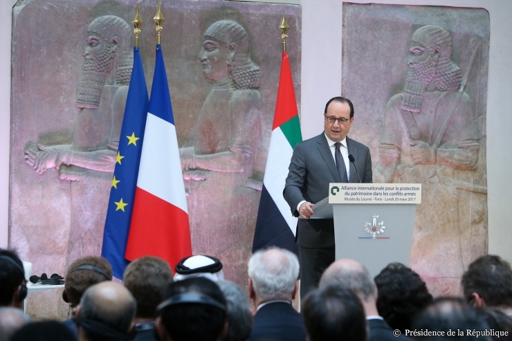 French resident Francois Hollande speaks to the conference