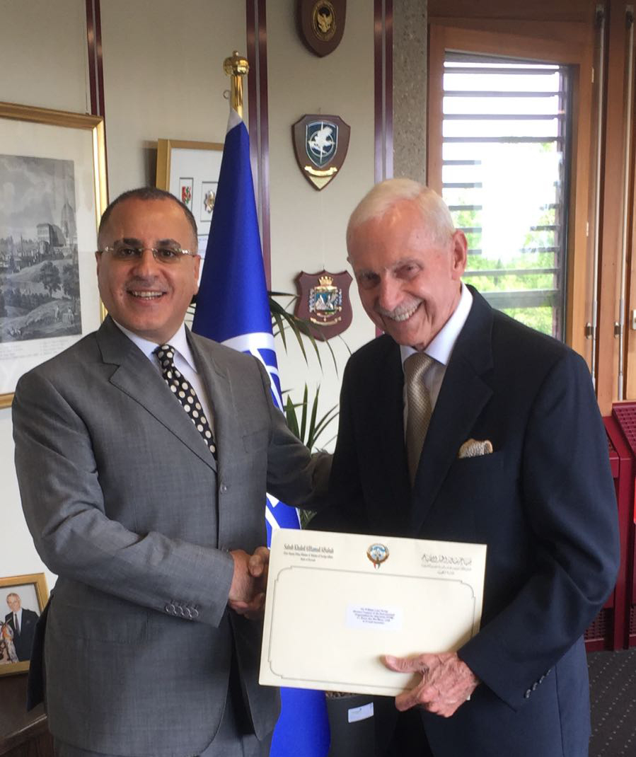 Kuwaiti Permanent Representative to the European headquarters of the UN and international organizations in Geneva Ambassador Jamal Al-Ghunaim submits the application to IOM's Director General William Lacy Swing
