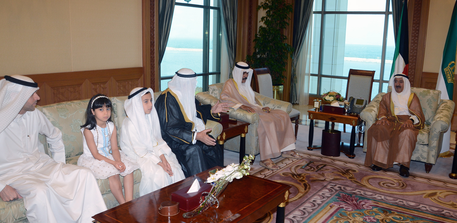 His Highness the Amir Sheikh Sabah Al-Ahmad Al-Jaber Al-Sabah receives fathers of martyrs; Grand Mosque Imam Sheikh Waleed Al-Ali and Sheikh Fahad Al-Husseini