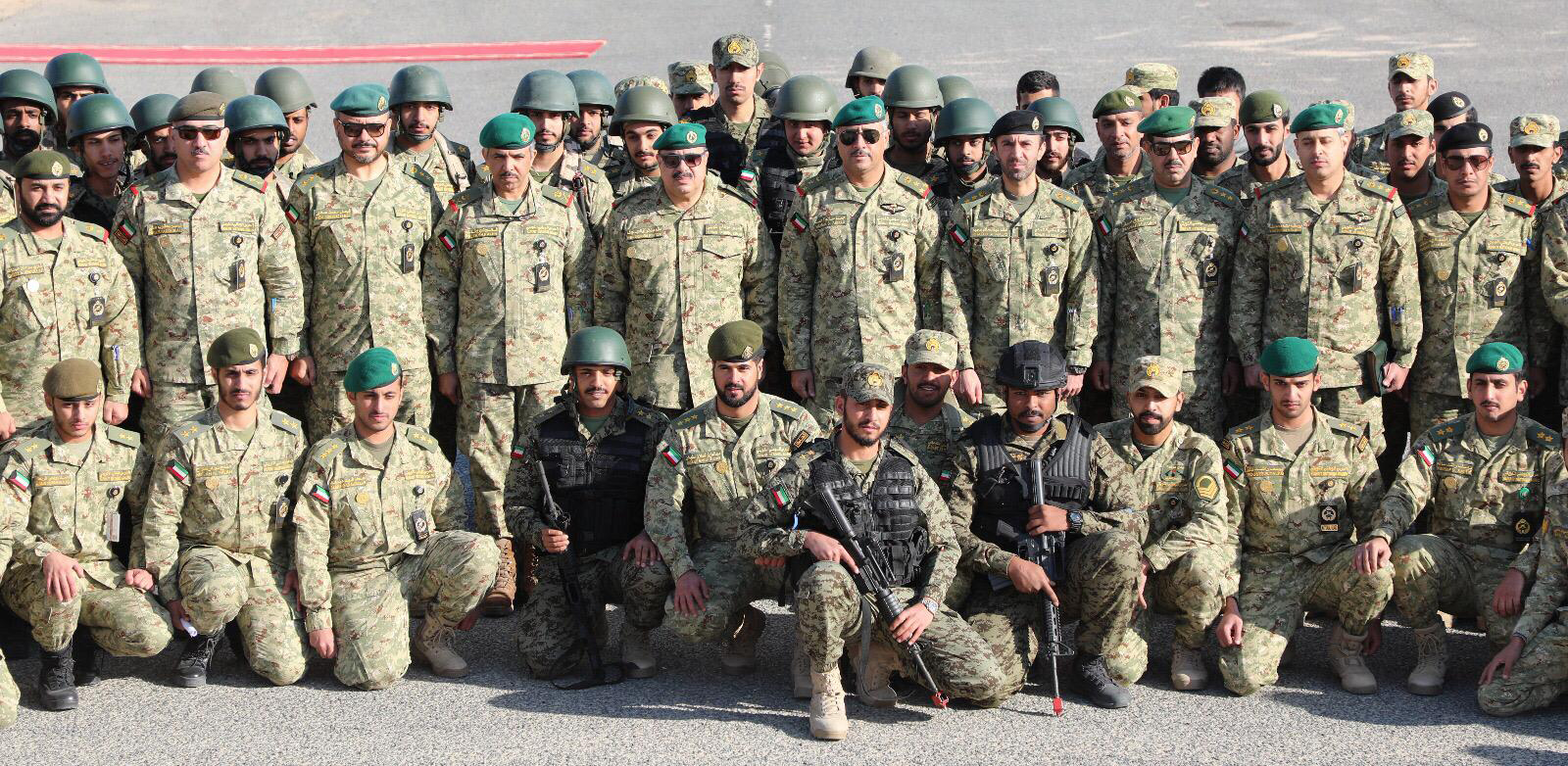 Kuwait National Guard (KNG) Undersecretary Lt. Gen. Hashem Al-Rifae with 32nd foundational training course trainees