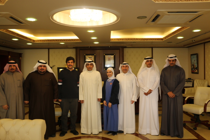 Kuwaiti Education Minister Dr. Hamid Al-Azmi meets a pair of standout students, Hadi Al-Mutairi and Fatma Al-Qarashi