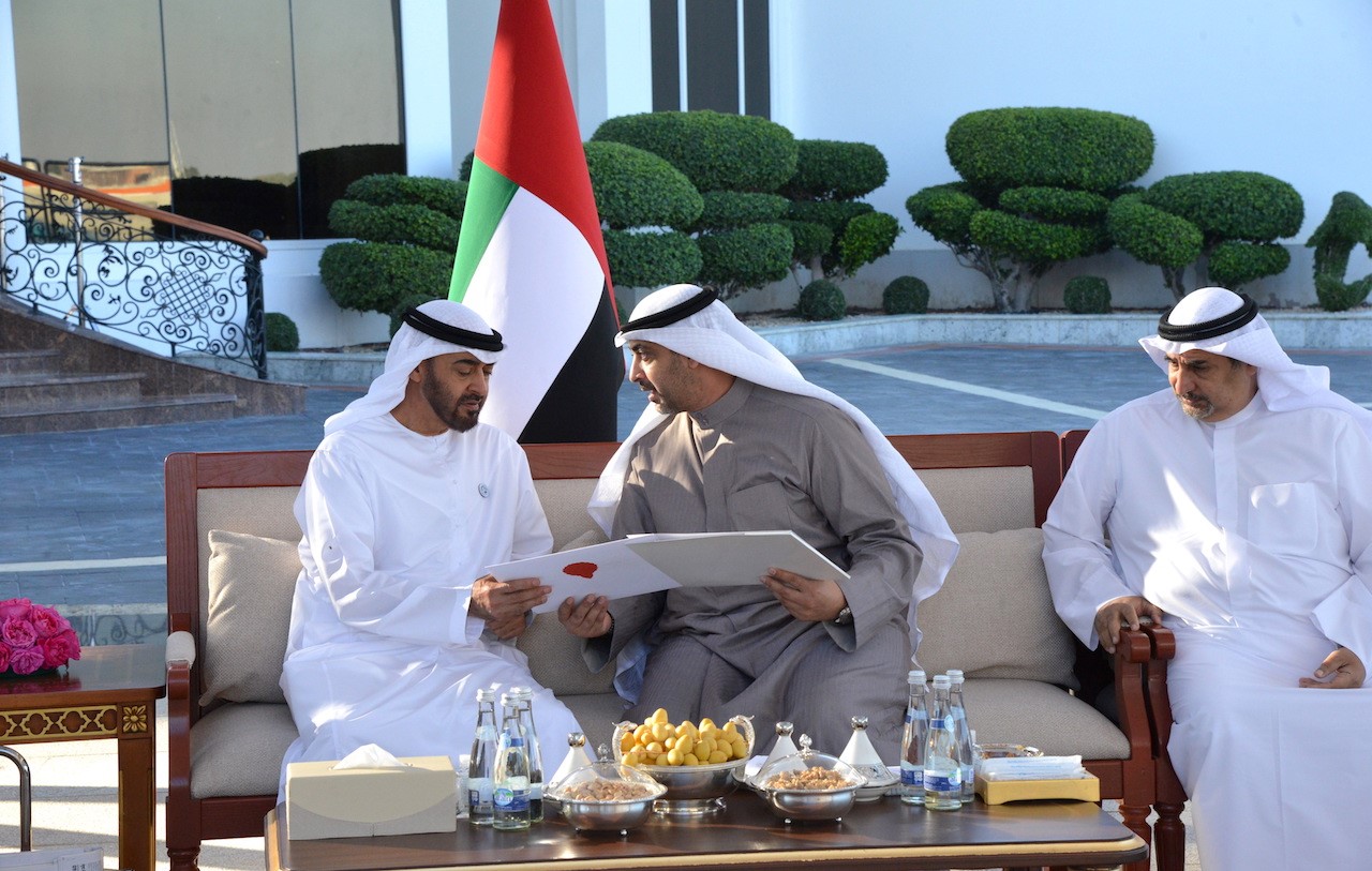 His Highness the Amir's Envoy, Deputy Minister of Amiri Diwan Affairs Sheikh Mohammad Al-Abdullah Al-Mubarak Al-Sabah hands the letter to Abu Dhabi Crown Prince Sheikh Mohammad bin Zayed Al Nahyan