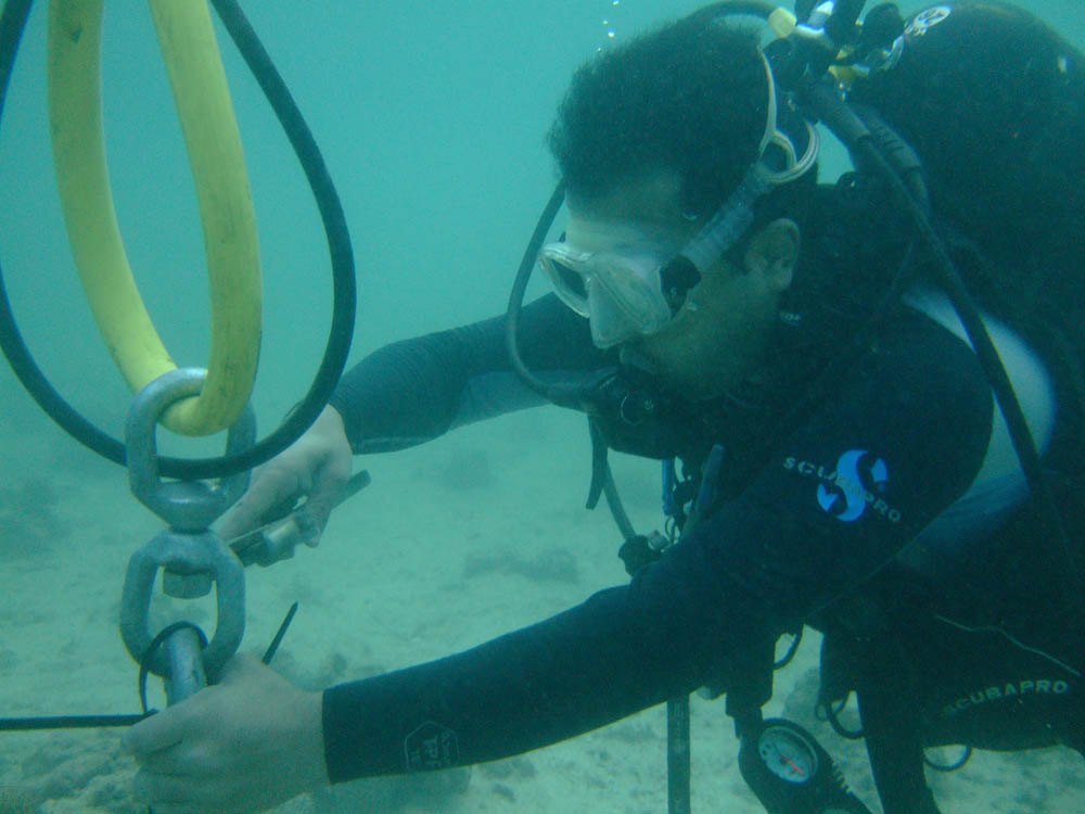 The Environmental Protection Society's diving team installing 20 marine buoys around the islands of Umm Maradem and Garoh to mark coral reef locations