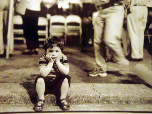 The artist's young cousin, Christopher, takes a quick break from dancing at Lebanese cultural festival