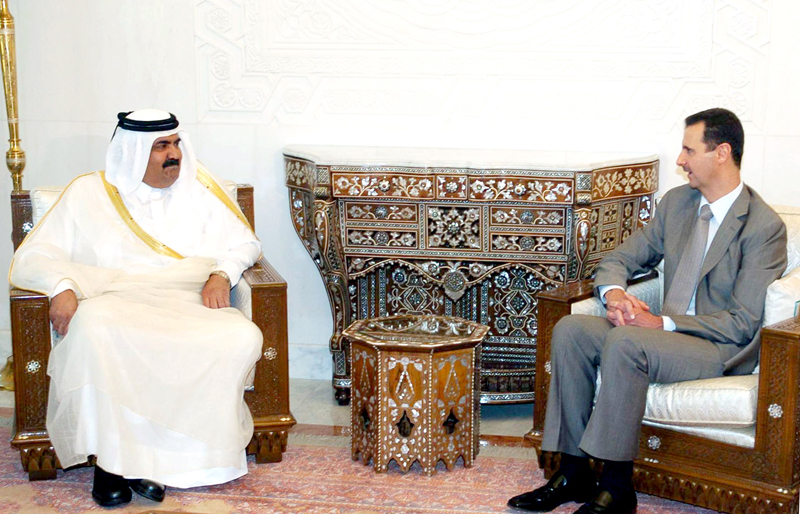 الرئيس السوري بشار الاسد  مستقبلا امير دولة قطر الشيخ حمد بن خليفة آل ثاني
