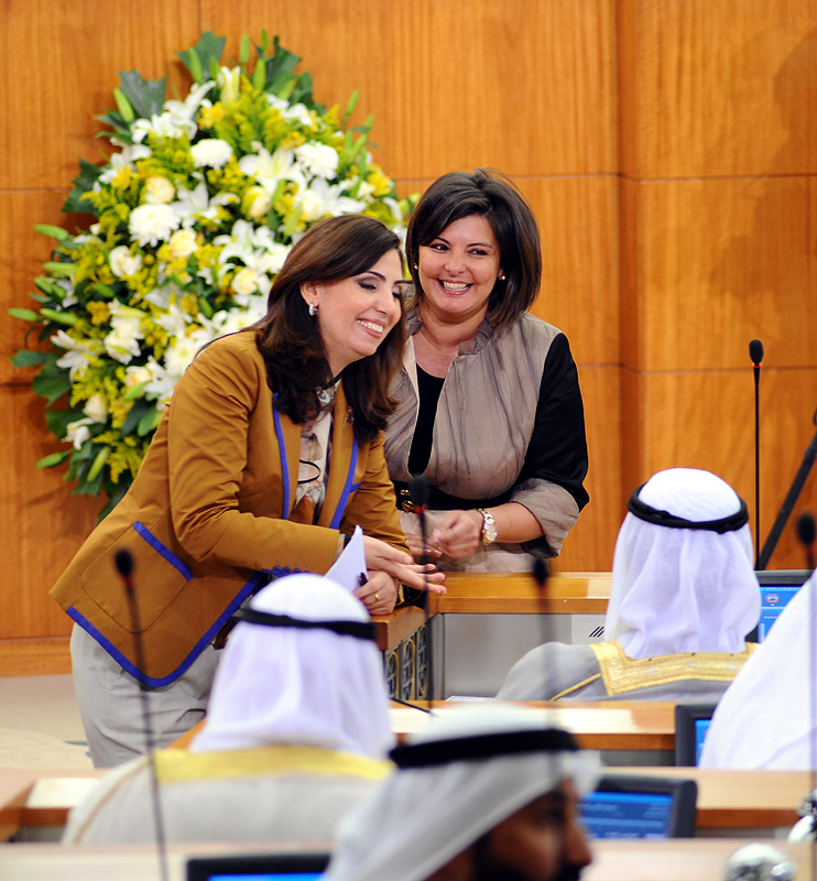 mp''s Aseel Al Awadi And Rula Dashti  speaking to the prime minister  on the sidelines  of the session