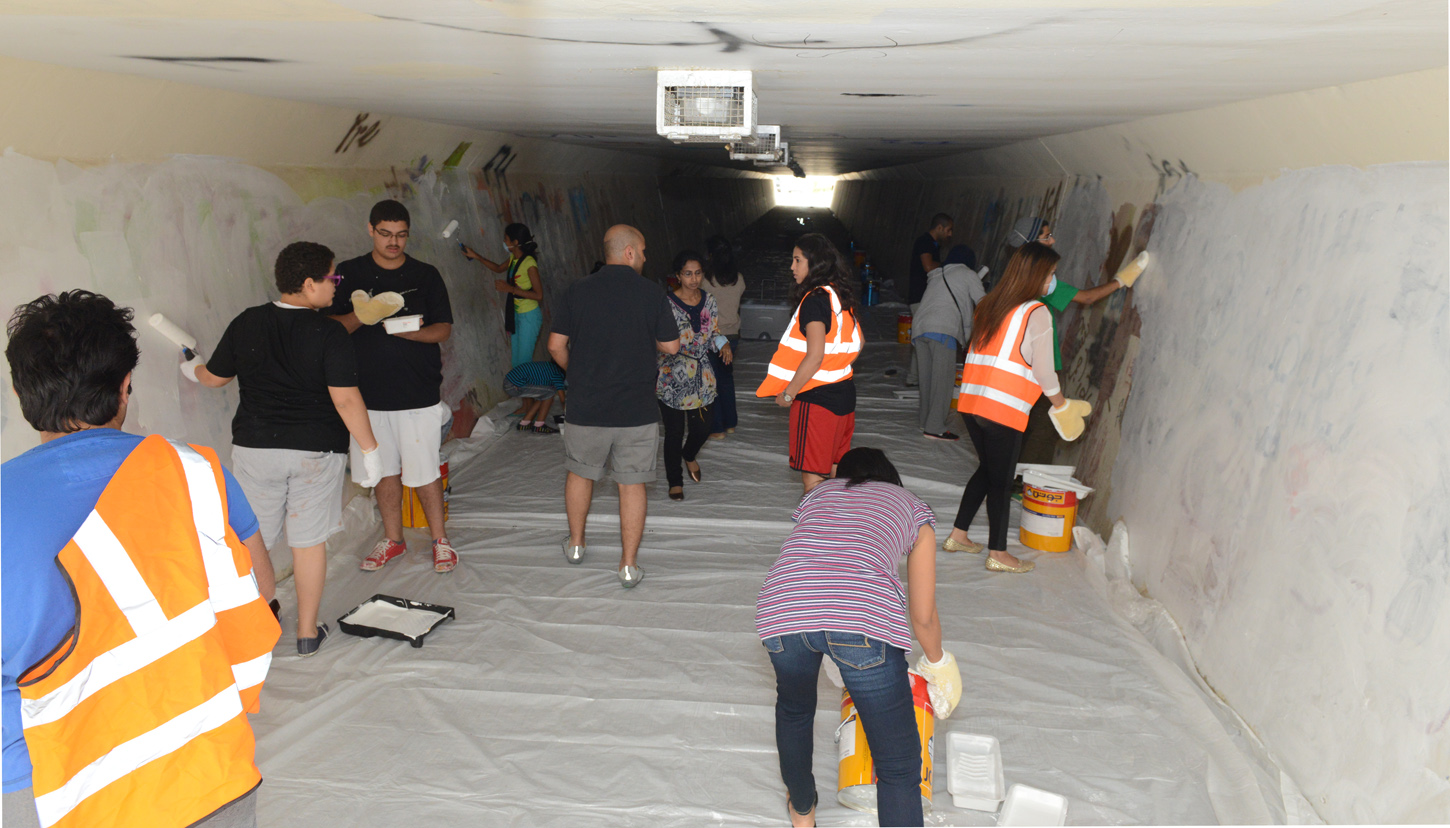 Young volunteers turn pedestrian tunnel into work of art