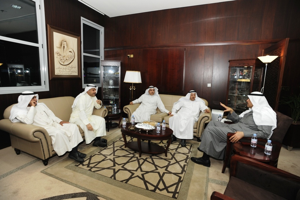 Minister of Information and Minister of State for Youth Affairs Sheikh Salman Al-Humoud with Burgan Sports Club Chairman Hamlan Al-Hamlan and Board members