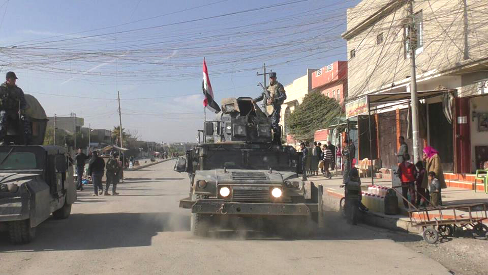 Iraqi troops in the free zone in the embattled city of Mosul