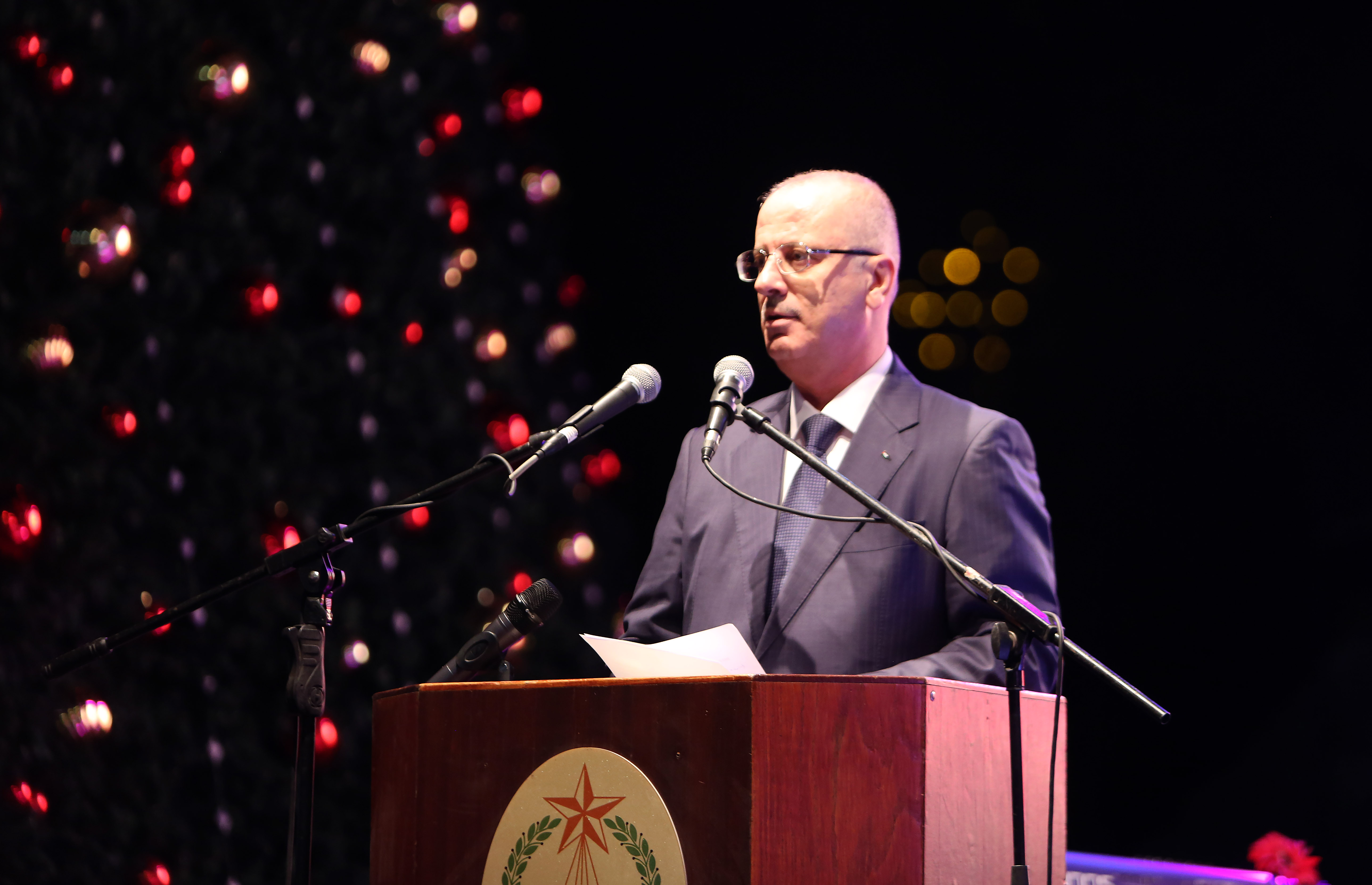 Palestinian Prime Minister Rami Hamdallah during a Christmas tree lighting ceremony outside the Church of the Nativity in the West Bank town of Bethlehem