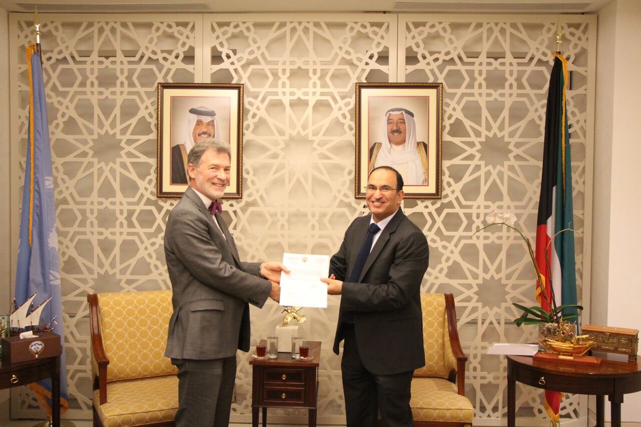 Kuwait's Permanent Representative to the UN Mansour Al-Otaibi with Director of UNRWA Representative Office in New York Peter Mulrean