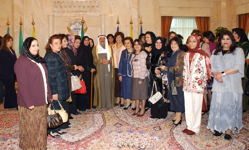 His Highness the Amir Sheikh Sabah Al-Ahmad Al-Jaber Al-Sabah with a group of prominent women