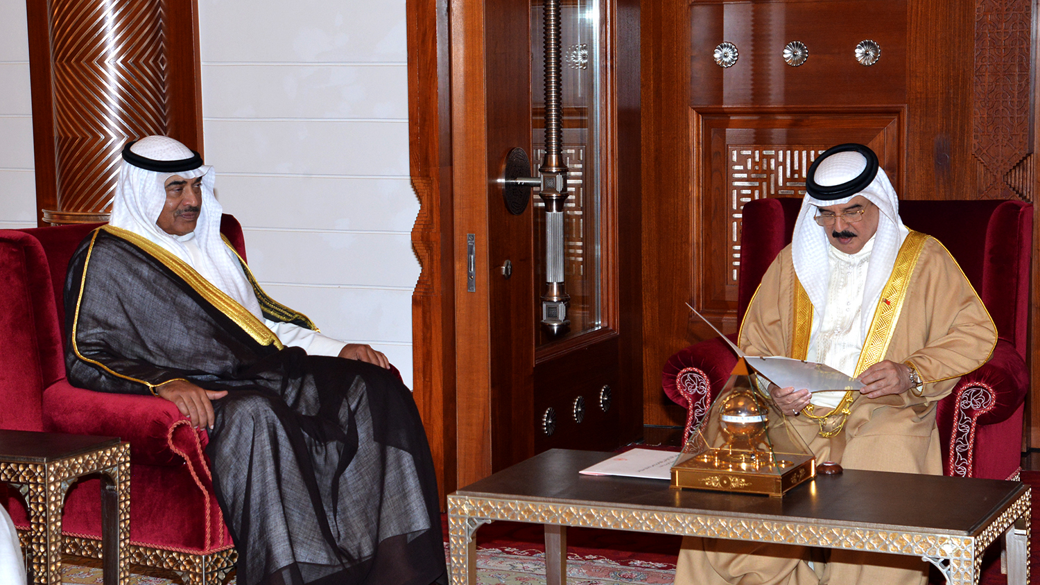 His Highness the Amir Sheikh Sabah Al-Ahmad Al-Jaber Al-Sabah's Envoy Foreign Minister Sheikh Sabah Al-Khaled Al-Hamad Al-Sabah delivers a letter to Bahraini King Hamad bin Isa Al-Khalifa