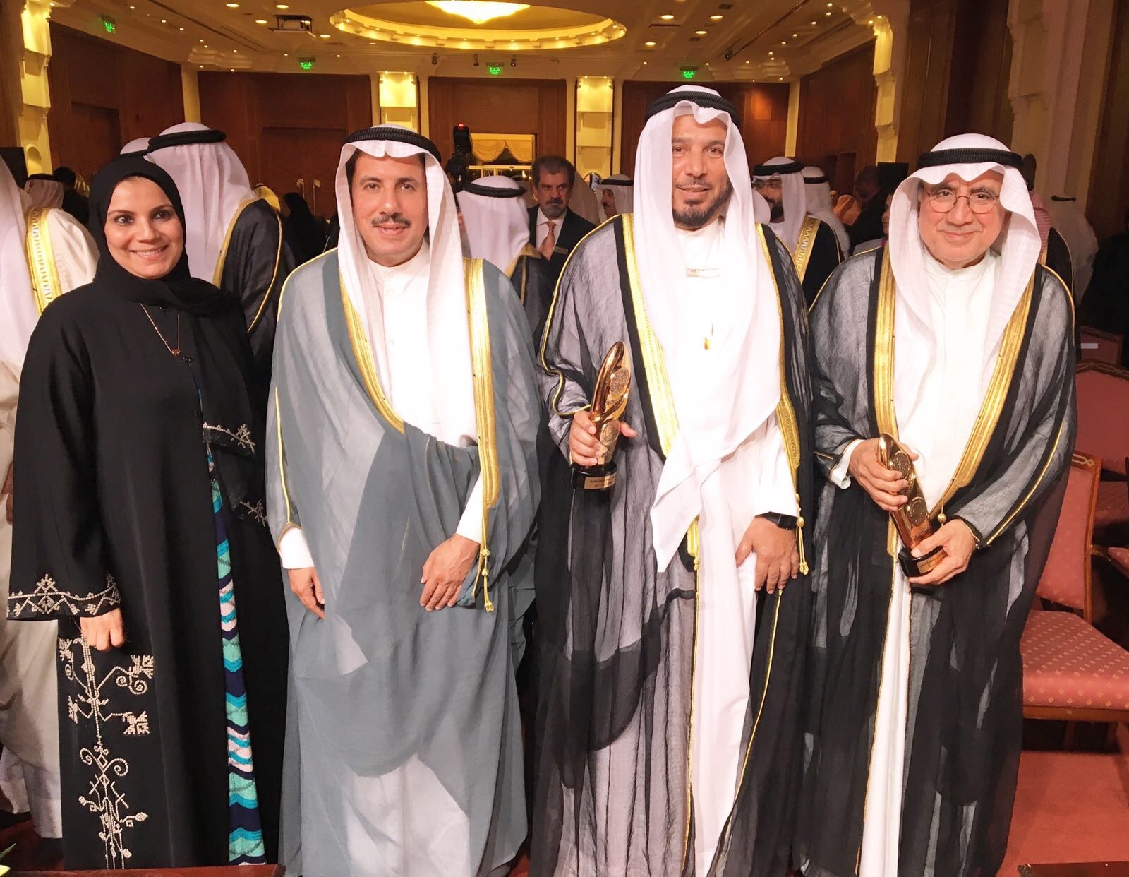 Dr. Abdullah Al-Maatouq, Abdulrahman Al-Faresi, and Dr. Amani Al-Tabtabai during the ceremony