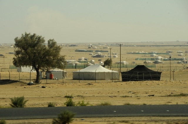 Kuwaiti people setting up spring camps, enjoying nice weather