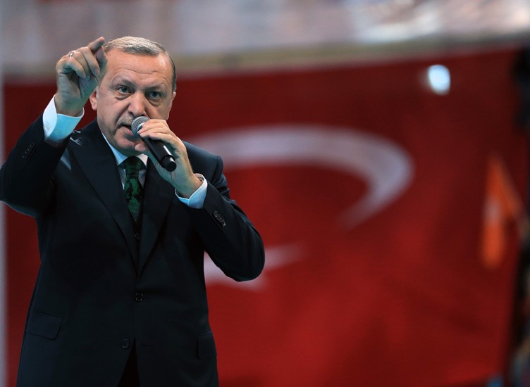 Turkish President Recep Tayyip Erdogan addresses the sixth conference of the ruling party