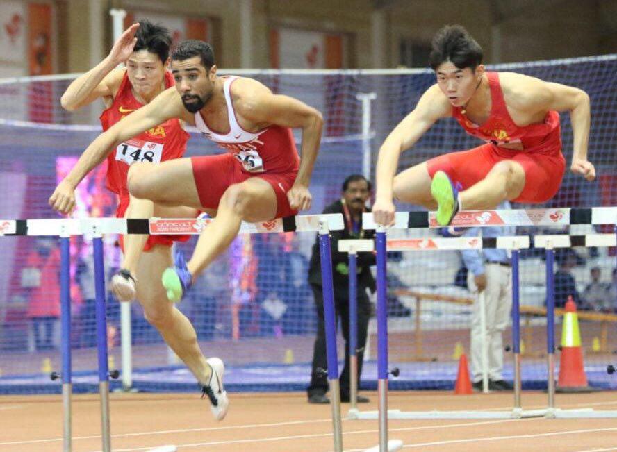 Kuwait's Abdulaziz Al-Mandeel wins the 60-meter hurdle race at the Asian indoor track and field tournament in Tehran