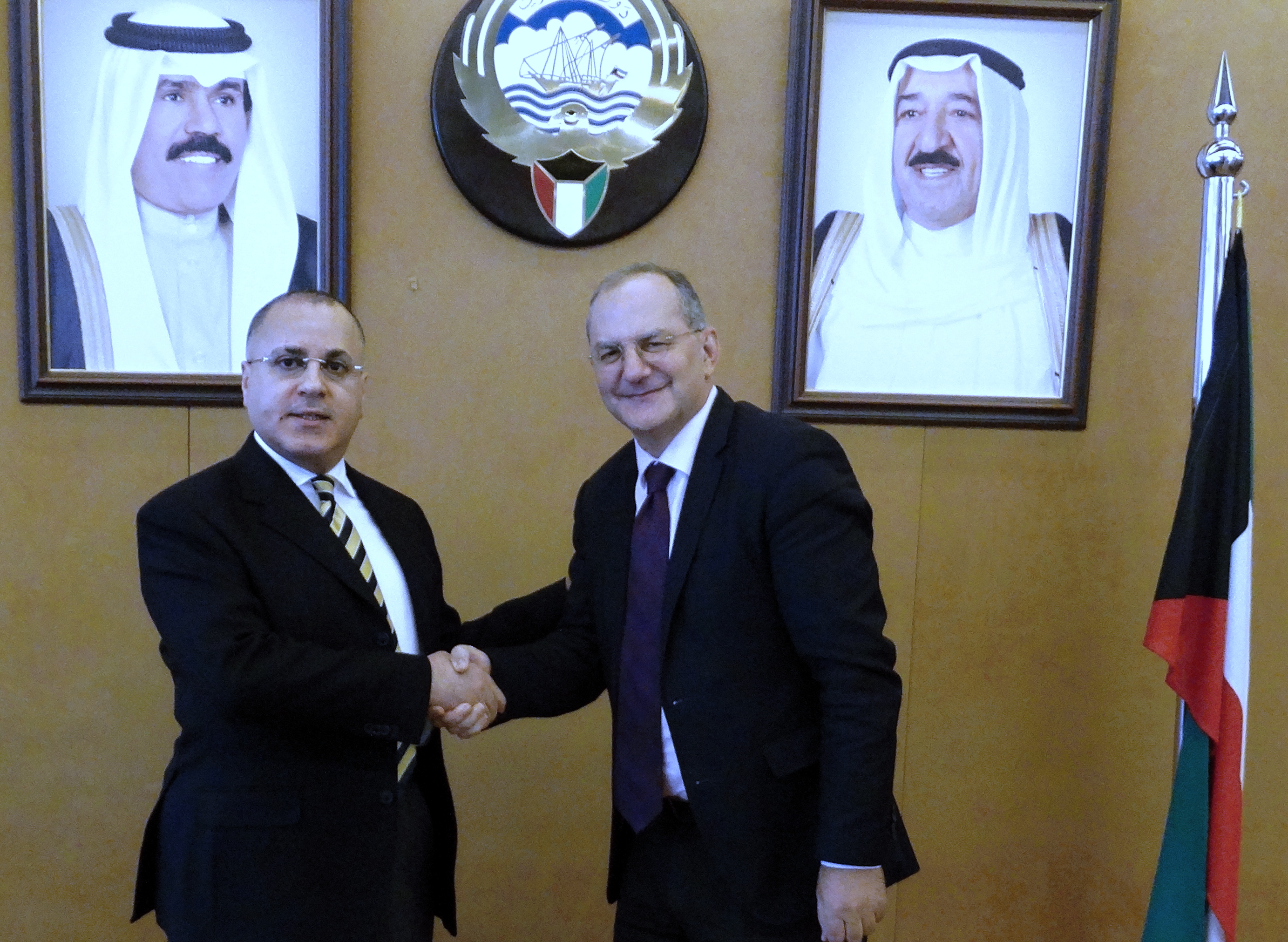 Kuwait's permanent delegate to the United Nations Ambassador Jamal Al-Ghunaim meets with the Executive Director of WHO's emergencies program Peter Salama