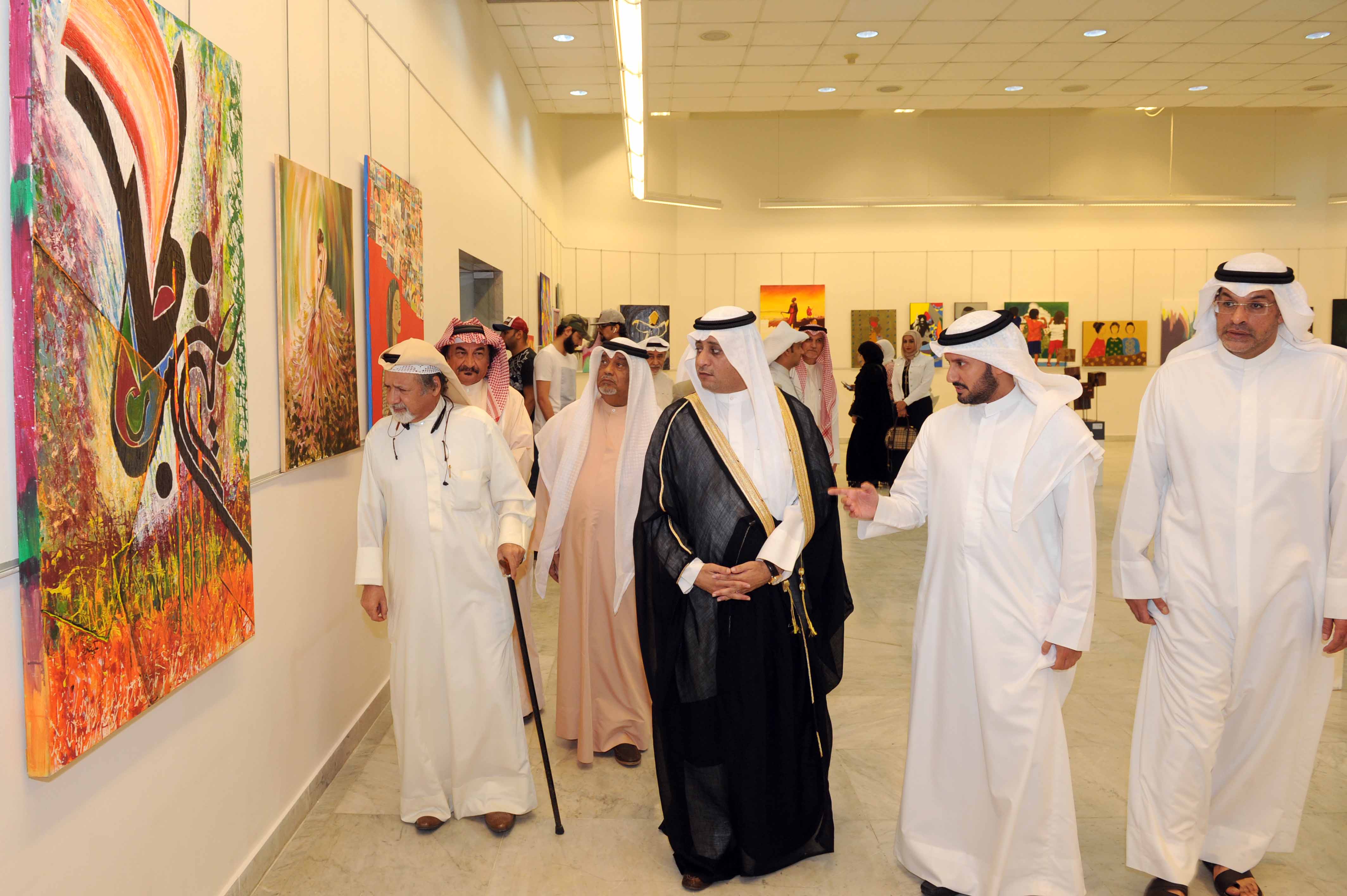 NCCAL's assistant secretary general for arts and theatre Bader Al-Duwaish and officials during the opening of the exhibition