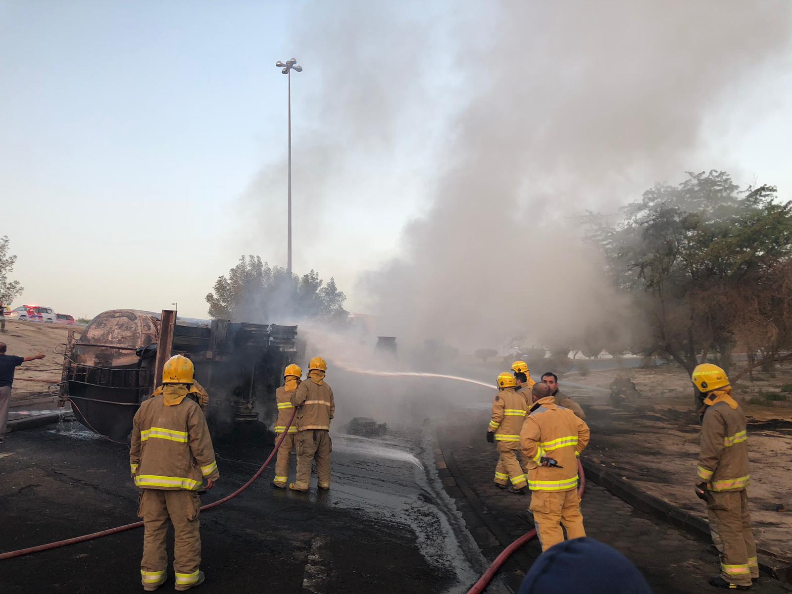 Firefighters put out a fire in a patrol tanker